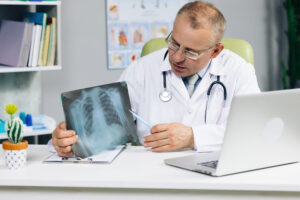 A doctor shows xray results using a video telehealth appointment.